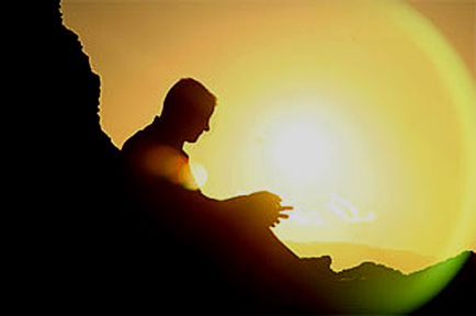 man-sitting-on-rocks